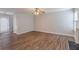 Open living room featuring wood floors, neutral walls, and a door to the backyard at 4185 Post Oak Grv, Atlanta, GA 30349