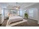 Spacious main bedroom with tray ceiling, plush bedding, and ample natural light, a serene escape at 4185 Post Oak Grv, Atlanta, GA 30349