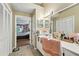 Bathroom vanity with double sinks and view into the main bedroom at 912 Spring Vly, Woodstock, GA 30189