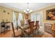Formal dining room with hardwood floors, large window, and chandelier at 912 Spring Vly, Woodstock, GA 30189