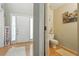 Open entryway with hardwood floors leads to a brightly lit living space at 912 Spring Vly, Woodstock, GA 30189
