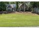 Charming home with a well-maintained lawn, mature trees, and appealing curb appeal, set on a small hill at 912 Spring Vly, Woodstock, GA 30189