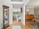Inviting foyer with hardwood floors, decorative cabinet, and view of staircase at 912 Spring Vly, Woodstock, GA 30189