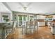 Eat-in kitchen with hardwood floors, white cabinets, kitchen island, and pendant lights at 912 Spring Vly, Woodstock, GA 30189