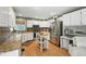 Bright kitchen features granite countertops, stainless steel appliances, and a mobile island at 912 Spring Vly, Woodstock, GA 30189