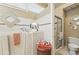 Bright bathroom with walk in tub, shower, tiled walls, and a window at 912 Spring Vly, Woodstock, GA 30189