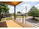 Inviting balcony with wooden flooring, metal railings, and a view of the street and surrounding neighborhood at 941 Garibaldi Sw St, Atlanta, GA 30310