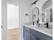 This bathroom offers dual sinks with stone counters, undermount sinks, and modern fixtures at 941 Garibaldi Sw St, Atlanta, GA 30310