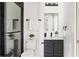 Modern bathroom featuring a black-framed glass shower, dark-wood vanity, and sleek fixtures at 941 Garibaldi Sw St, Atlanta, GA 30310