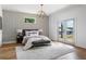 This bedroom offers hardwood floors, designer wallpaper, and access to an outdoor space at 941 Garibaldi Sw St, Atlanta, GA 30310