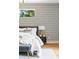 This bedroom features designer wallpaper, an upholstered headboard, and neutral colored bedding at 941 Garibaldi Sw St, Atlanta, GA 30310