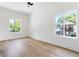 This bedroom provides lots of natural light, wood floors and scenic views through large windows at 941 Garibaldi Sw St, Atlanta, GA 30310