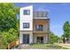 Stunning modern home with three stories and beautiful balconies and clean, neutral colors at 941 Garibaldi Sw St, Atlanta, GA 30310