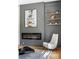Modern living room features a sleek fireplace with shelving, a geometric rug, and sleek, comfortable seating at 941 Garibaldi Sw St, Atlanta, GA 30310