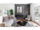 Modern living room features a sleek fireplace with shelving and sleek, comfortable seating at 941 Garibaldi Sw St, Atlanta, GA 30310