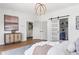 This bedroom features hardwood floors, neutral decor, and access to the ensuite bath at 941 Garibaldi Sw St, Atlanta, GA 30310
