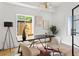 Bright office with a modern desk, stylish chairs, and chic decor, creating an inspiring and productive workspace at 941 Garibaldi Sw St, Atlanta, GA 30310