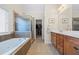 Bathroom boasts a soaking tub, shower, and closet at 1524 Guthrie Crossing Dr, Loganville, GA 30052
