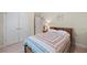Comfortable bedroom features plush carpet, double closets, and a neutral color scheme at 1524 Guthrie Crossing Dr, Loganville, GA 30052