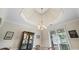 Dining room with a trey ceiling and natural light at 1524 Guthrie Crossing Dr, Loganville, GA 30052