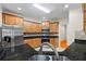 Modern kitchen featuring stainless steel appliances, granite countertops, and abundant cabinet storage at 1524 Guthrie Crossing Dr, Loganville, GA 30052