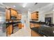 Well-appointed kitchen with stainless appliances, granite countertops, tile flooring, and ample storage at 1524 Guthrie Crossing Dr, Loganville, GA 30052
