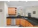 Charming kitchen with granite counters, stainless steel appliances and a view to the living room at 1524 Guthrie Crossing Dr, Loganville, GA 30052