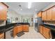 Bright, open kitchen with tile flooring, granite counters and stainless steel appliances at 1524 Guthrie Crossing Dr, Loganville, GA 30052