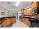 Updated kitchen with stainless steel appliances, granite countertops, and ample cabinet space at 1524 Guthrie Crossing Dr, Loganville, GA 30052