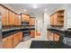 Well-lit kitchen featuring tile floors, granite countertops, and stainless steel appliances at 1524 Guthrie Crossing Dr, Loganville, GA 30052