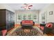Inviting living room with hardwood floors, decorative rug, and a comfortable seating arrangement at 1524 Guthrie Crossing Dr, Loganville, GA 30052