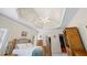 Trey ceiling and a ceiling fan add architectural interest to this spacious, carpeted main bedroom at 1524 Guthrie Crossing Dr, Loganville, GA 30052