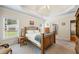 Comfortable main bedroom with trey ceilings and carpet flooring at 1524 Guthrie Crossing Dr, Loganville, GA 30052