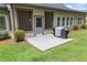 Back patio with grill, ideal for outdoor entertainment with landscaping and manicured lawn at 1524 Guthrie Crossing Dr, Loganville, GA 30052