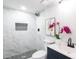 Bathroom with a shower stall, marble tile walls and floors, and a modern sink at 1749 Lauranceae Way, Riverdale, GA 30296