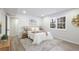 Bedroom with a large window, neutral decor and a decorative rug at 1749 Lauranceae Way, Riverdale, GA 30296