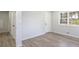 Bedroom features natural light with wood floor, and fresh paint at 1749 Lauranceae Way, Riverdale, GA 30296