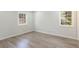 A bedroom with natural lighting, hardwood floors, and a neutral color palette at 1749 Lauranceae Way, Riverdale, GA 30296