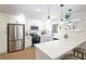 Modern kitchen featuring stainless steel appliances, white cabinetry, and quartz countertops at 1749 Lauranceae Way, Riverdale, GA 30296