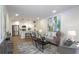 Open-concept living room flows into the kitchen, creating an ideal space for entertaining and relaxation at 1749 Lauranceae Way, Riverdale, GA 30296