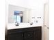 Bathroom featuring dual vanity and dark wood cabinets at 3402 Wynnewood Ln, Duluth, GA 30096