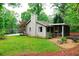 Charming home exterior with a well-manicured lawn and a lovely screened-in porch at 3402 Wynnewood Ln, Duluth, GA 30096