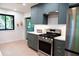 Kitchen showcasing stainless steel appliances, white countertops, and blue cabinetry at 3402 Wynnewood Ln, Duluth, GA 30096