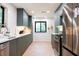 Bright kitchen with stainless steel appliances and window view to backyard at 3402 Wynnewood Ln, Duluth, GA 30096
