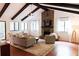 Living room with exposed beams, stone fireplace, neutral colors, and lots of natural light at 3402 Wynnewood Ln, Duluth, GA 30096