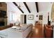 Living room boasts natural light, exposed beams, and flows into the dining area at 3402 Wynnewood Ln, Duluth, GA 30096