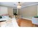Well-lit playroom with wood floors, backyard access, wood-paneled walls, and ample room to play at 3402 Wynnewood Ln, Duluth, GA 30096