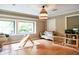 Spacious playroom with wood floors, large windows, and access to a backyard, perfect for  at 3402 Wynnewood Ln, Duluth, GA 30096
