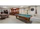 Finished basement featuring a pool table, bar, staircase, and an adjacent seating area at 770 Spalding Heights Dr, Atlanta, GA 30350