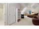 Spacious bedroom with ensuite bath, dormer window, desk, and a ceiling fan with lighting at 770 Spalding Heights Dr, Atlanta, GA 30350
